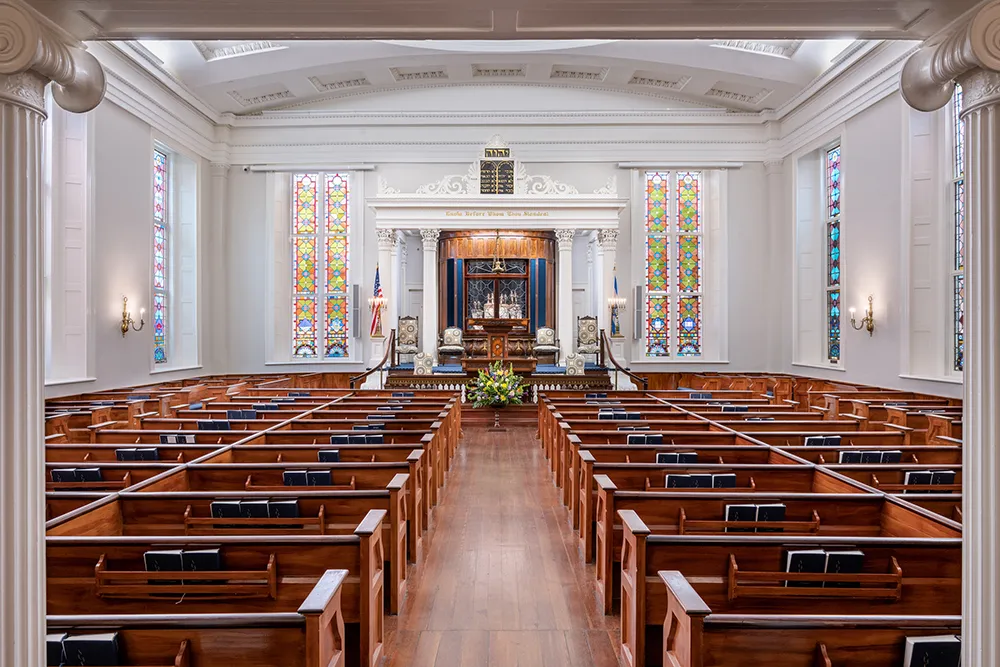 photo down an aisle to the front of the synagogue