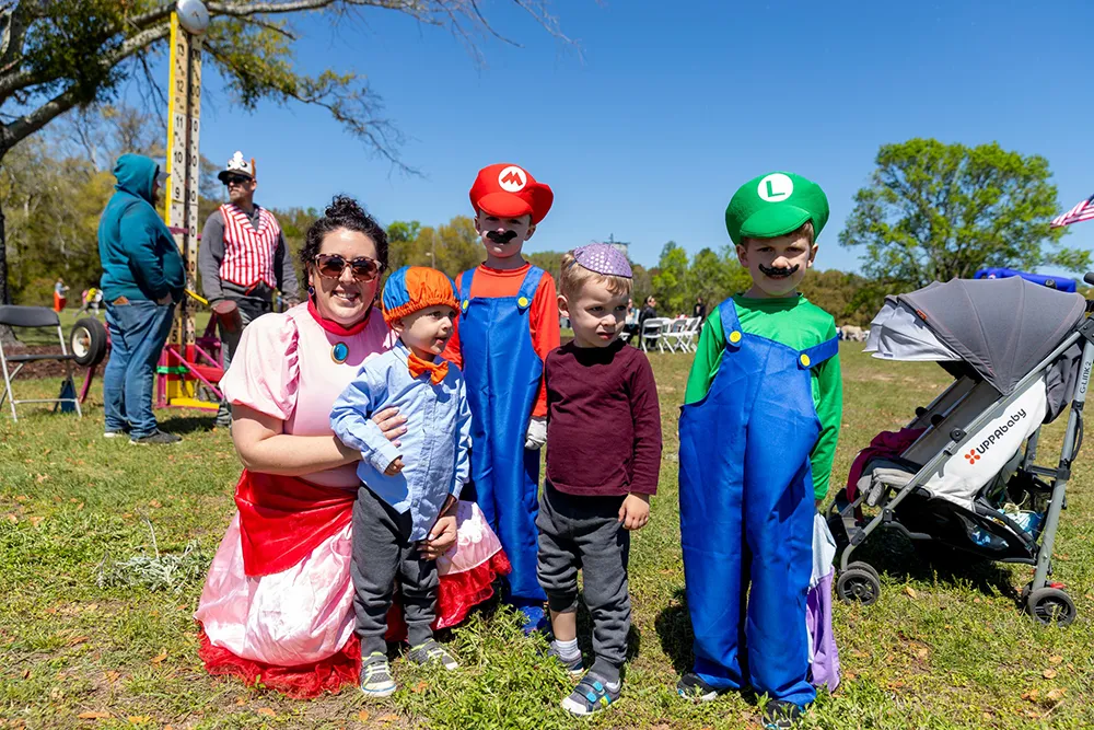 mother and children dressed in costumes for purim